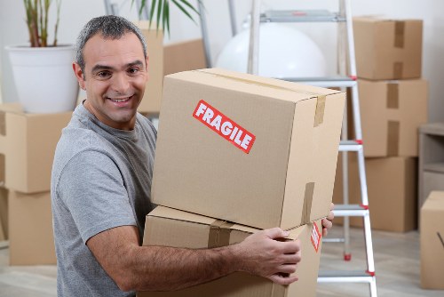 Local moving team working in a Queens Park flat with stairs and limited access