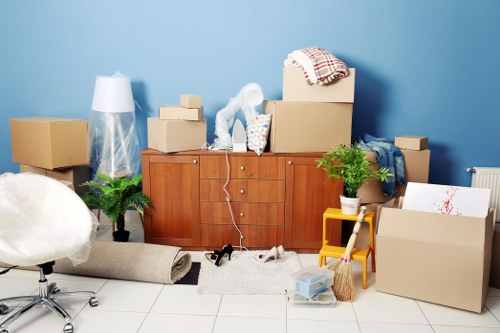 Removal van and moving team preparing a local house move in Queens Park