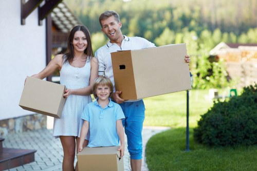 Local furniture removal service loading items safely from a home