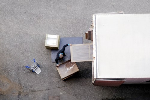 Local man and van service handling household items in Queens Park