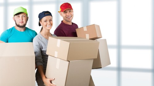 Professional removals van and movers preparing for a local relocation