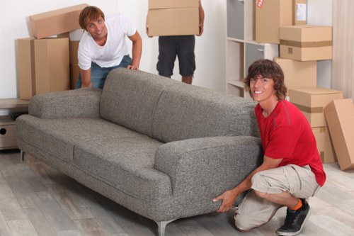 Packed boxes and furniture prepared for a local move in Queens Park