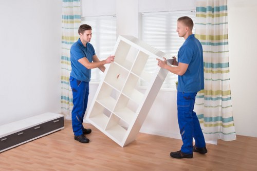 Careful loading of household furniture for a Queens Park move