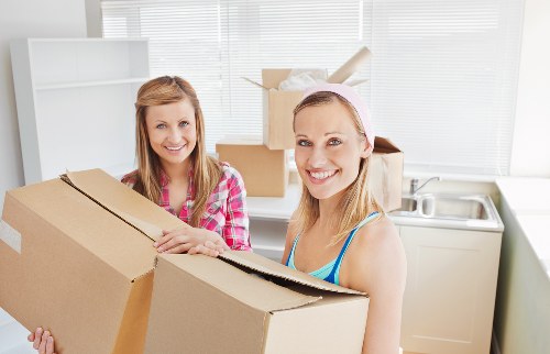 Packed office boxes and furniture ready for local relocation