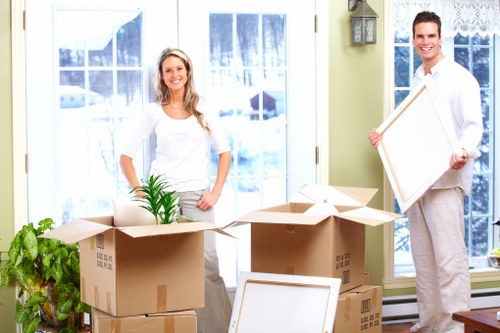 Movers handling boxes and furniture for a local property move