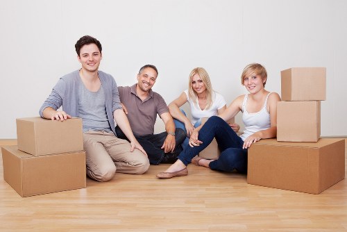 Packed living room items ready for flat removals in a Queens Park apartment