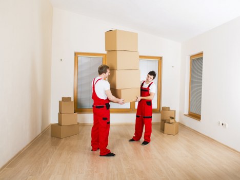 Local team handling office furniture and workstations during a Queens Park move